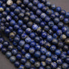 Close-up of blue beads on a dark background