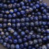 Close-up of blue beads on a dark background