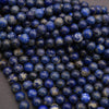 Close-up of blue beads on a dark background