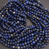 String of blue beads on a dark background