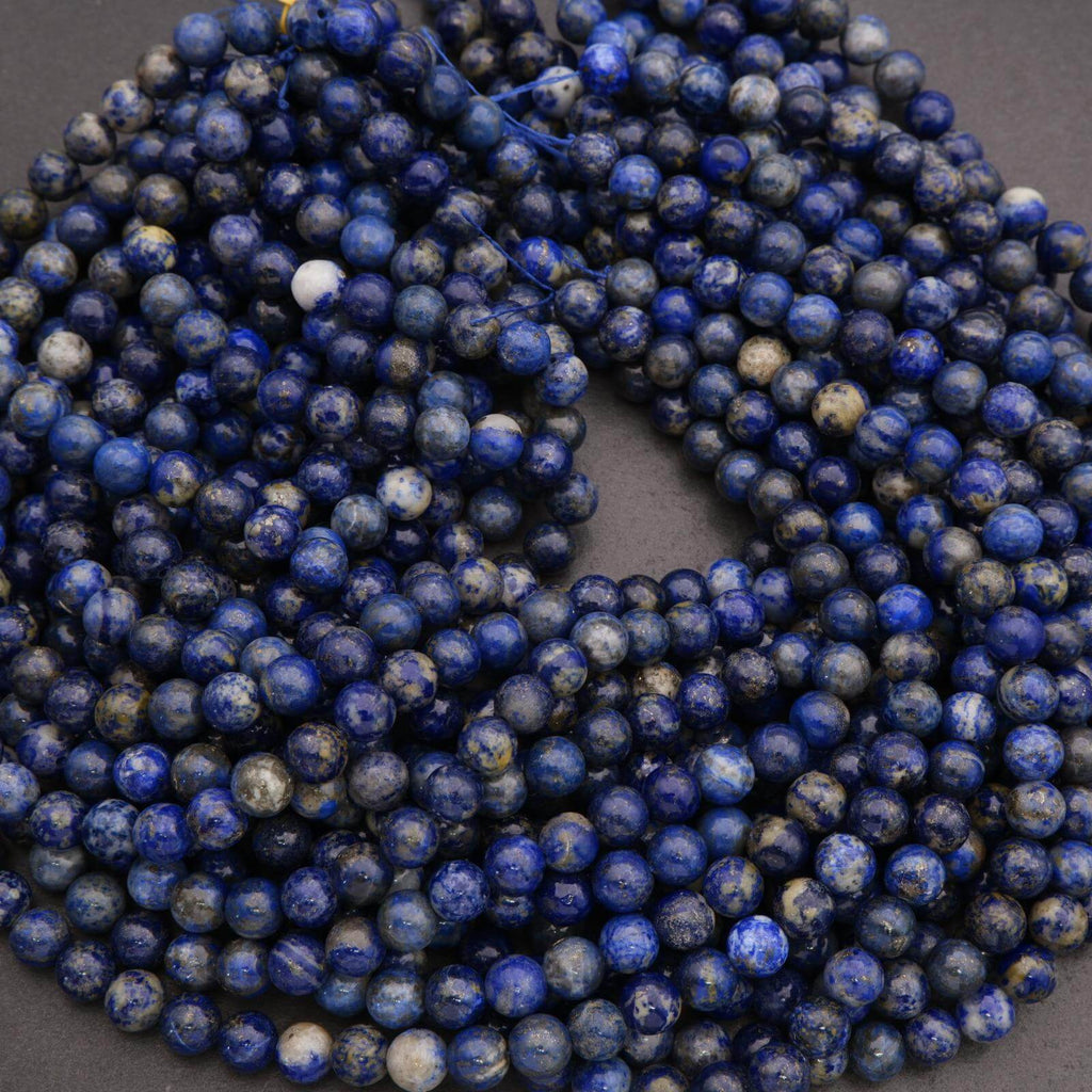 String of blue beads on a dark background