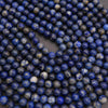 Close-up of blue beads on a dark background