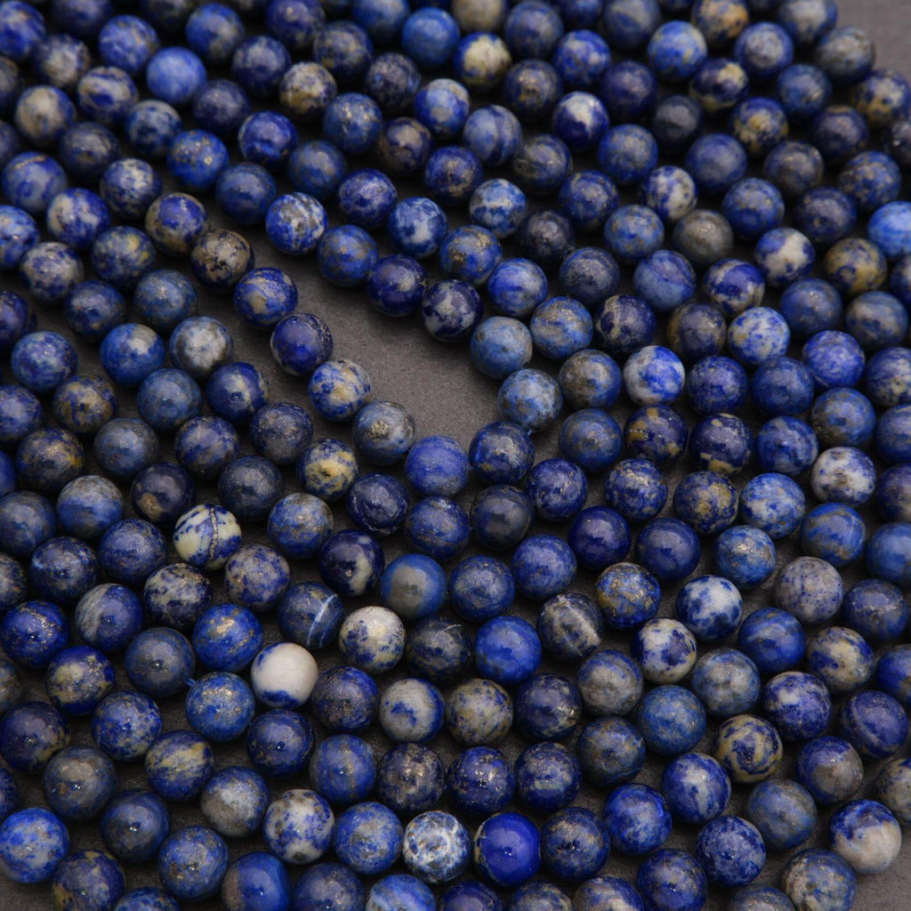 Close-up of blue beads on a dark background