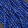 Close-up of blue beads on a dark background