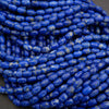 Close-up of blue beads on a dark background
