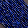 Close-up of blue beads on a gray background