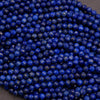 Close-up of blue beads on a dark background