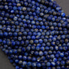Close-up of blue beads on a dark background
