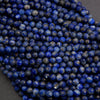 Close-up of blue beads on a dark background