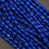 Close-up of blue marbled beads on a dark background
