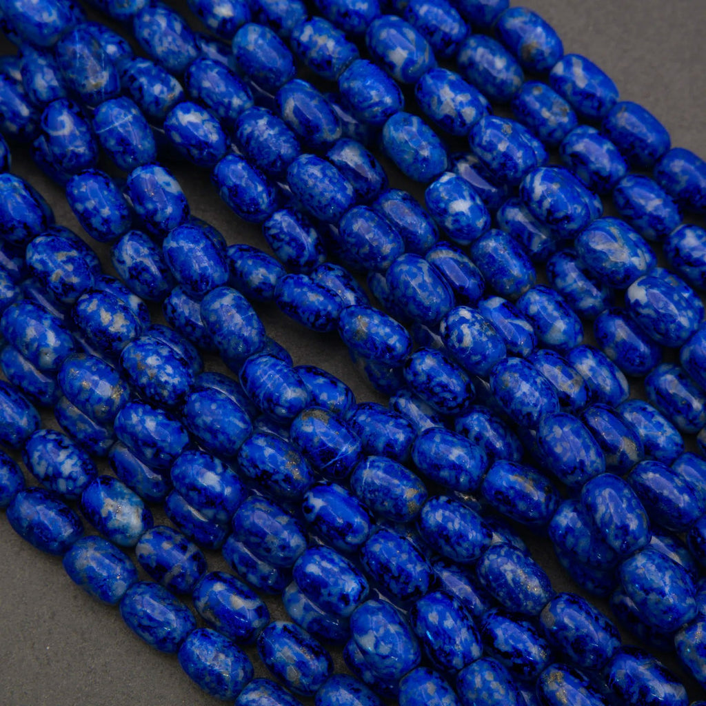 Close-up of blue marbled beads on a dark background