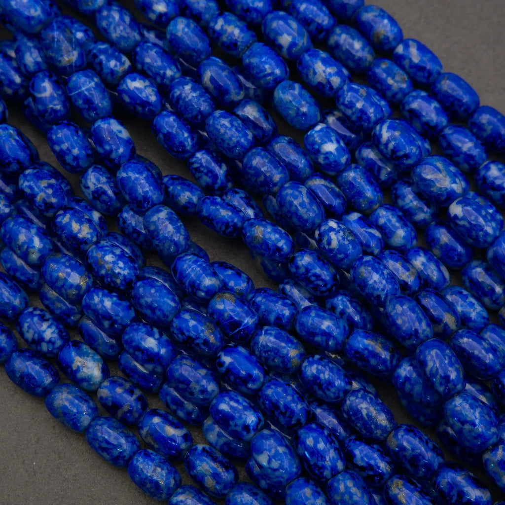 Close-up of blue marbled beads on a dark background