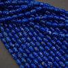 Close-up of blue marbled beads on a dark background