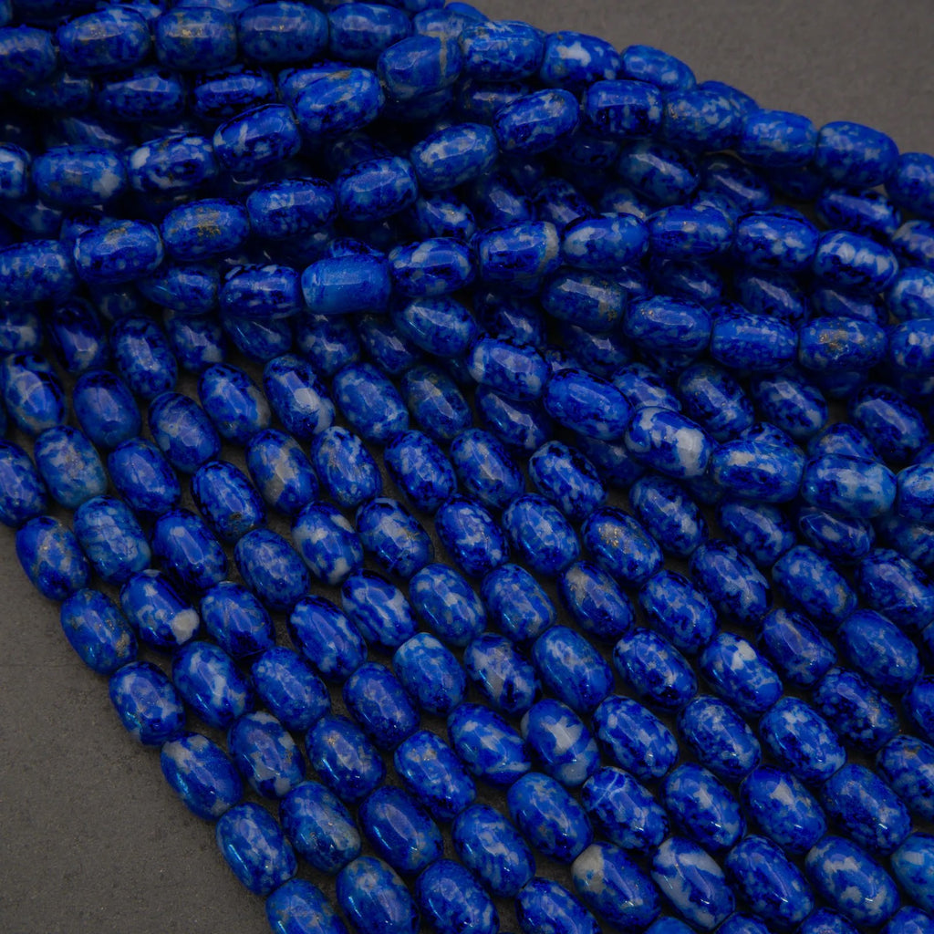 Close-up of blue marbled beads on a dark background