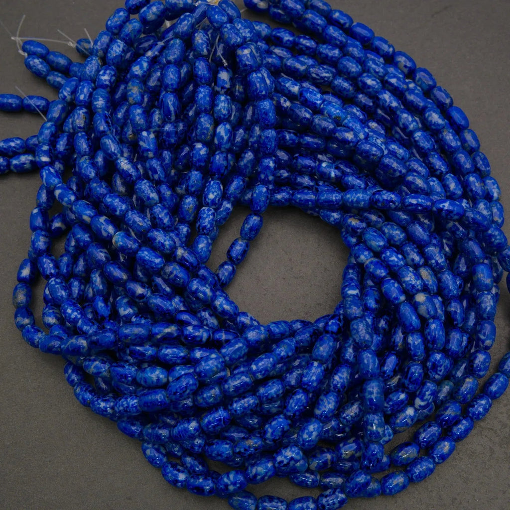 Close-up of blue marbled beads on a dark background