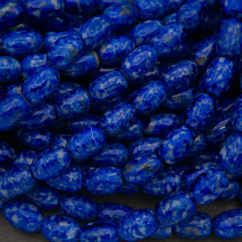 Close-up of blue marbled beads on a dark background