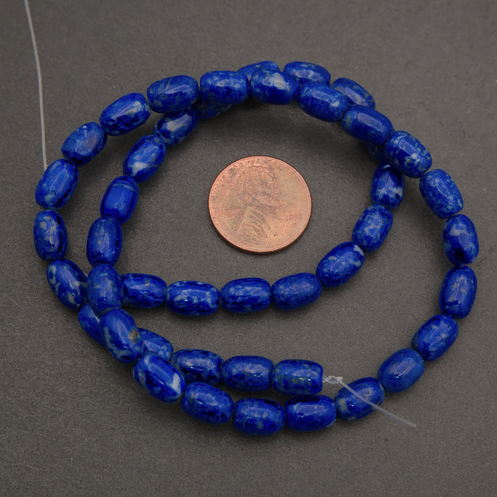 Close-up of blue marbled beads on a dark background