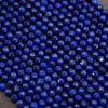 Close-up of blue beads on a dark background