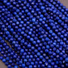 Close-up of blue beads on a dark background