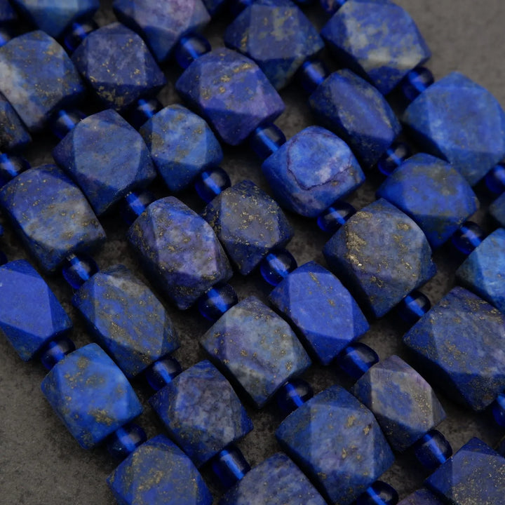 Close-up of blue faceted beads on a dark background