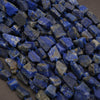 Close-up of blue stone beads on a dark background