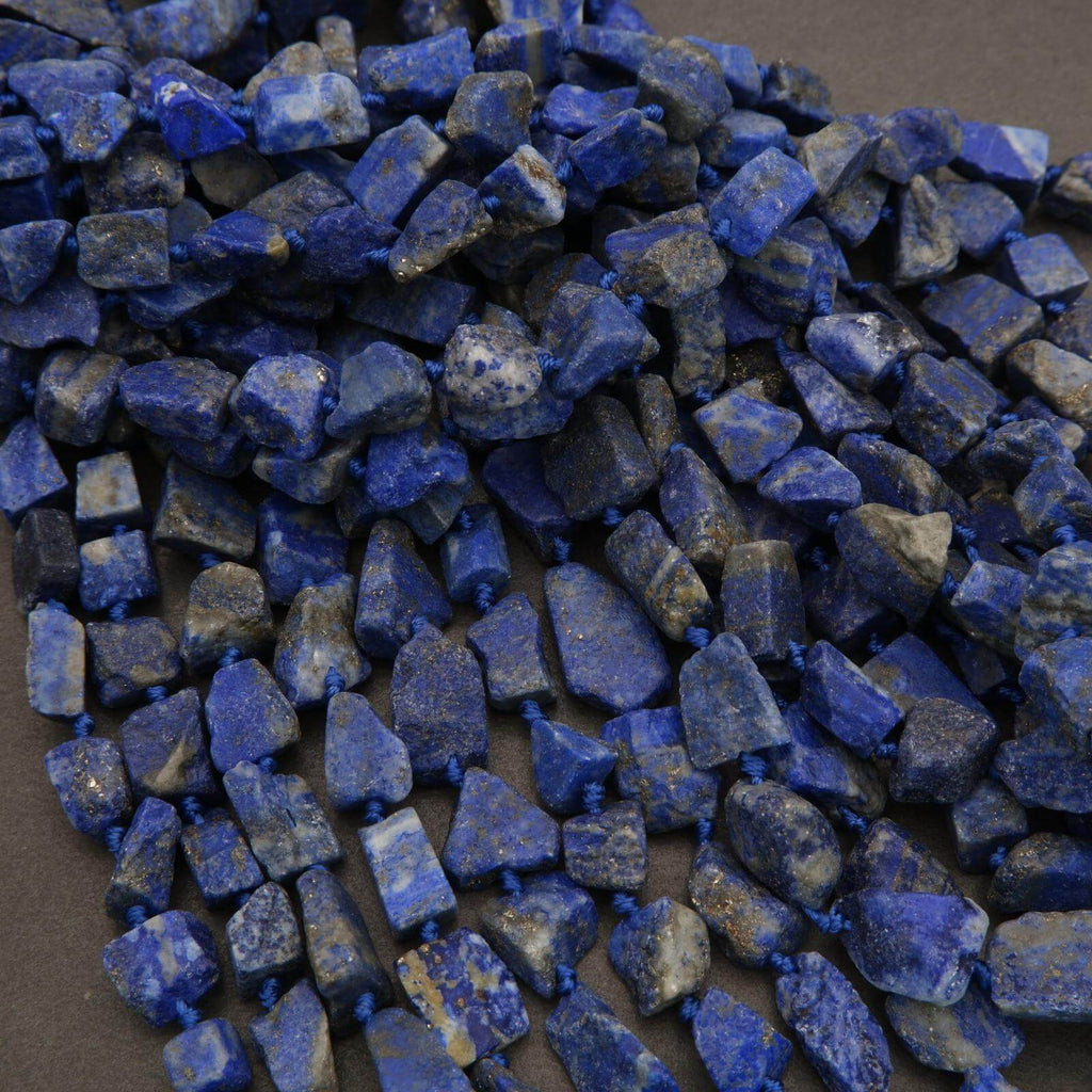 Close-up of blue stone beads on a dark background