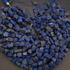 Blue stone beads on a dark surface