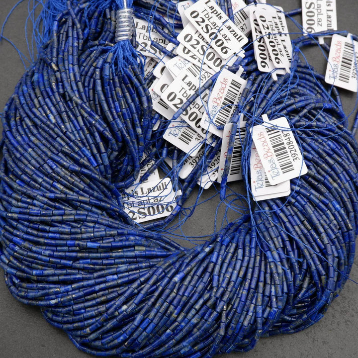 Blue beads with price tags on a gray surface