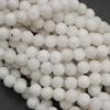 Close-up of white spherical beads on a dark background