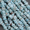 Close-up of blue turquoise beads on a dark background