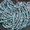 Turquoise beads with labels on a dark background