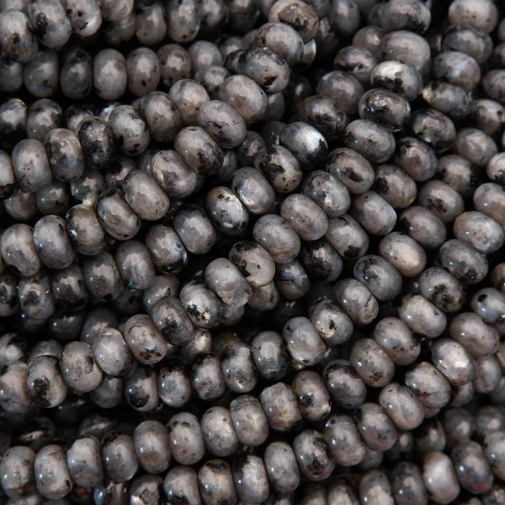 Close-up of dark gray beads with a slight sheen.