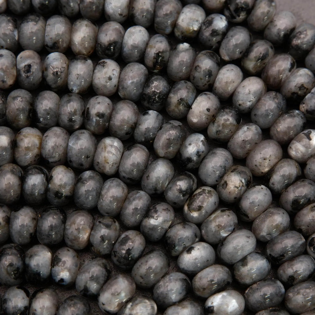 Close-up of dark gray beans with visible imperfections