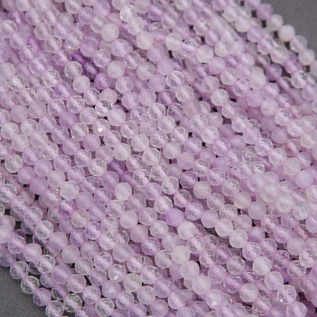 Close-up of purple beads on a gray surface