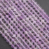 Close-up of purple beaded strands on a dark background