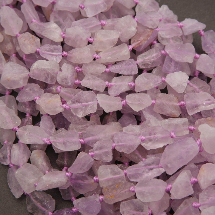 Close-up of pink beads on a dark background
