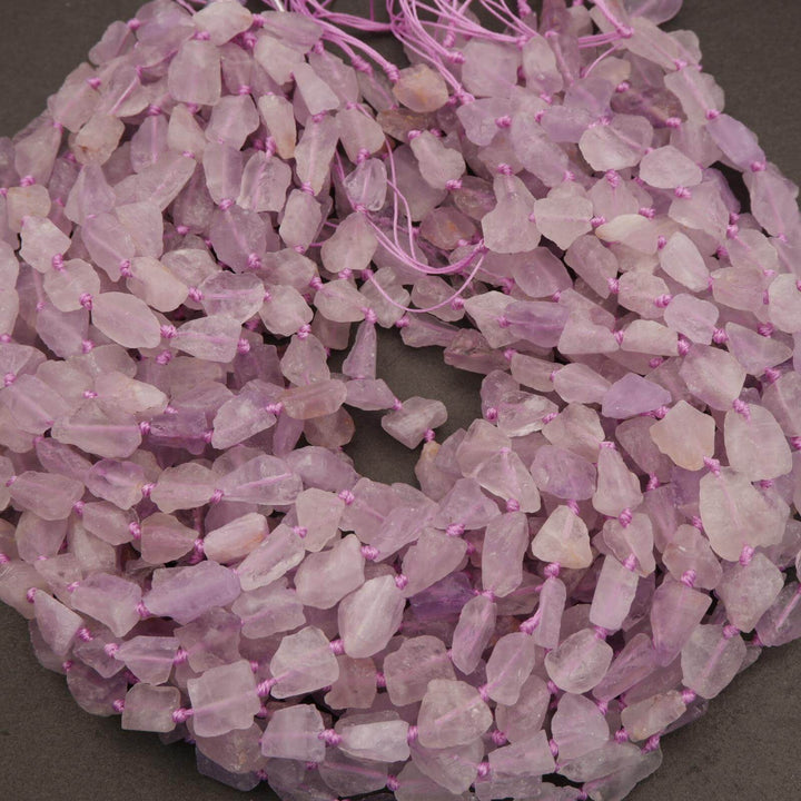 Close-up of pink beaded necklace on a dark background