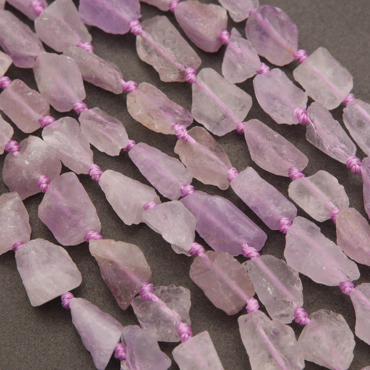 Close-up of pink crystal beads on a dark background