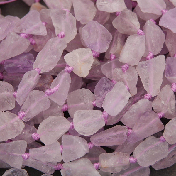 Close-up of pink crystal beads with pink stringing