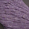 Close-up of a bundle of purple cylindrical beads.