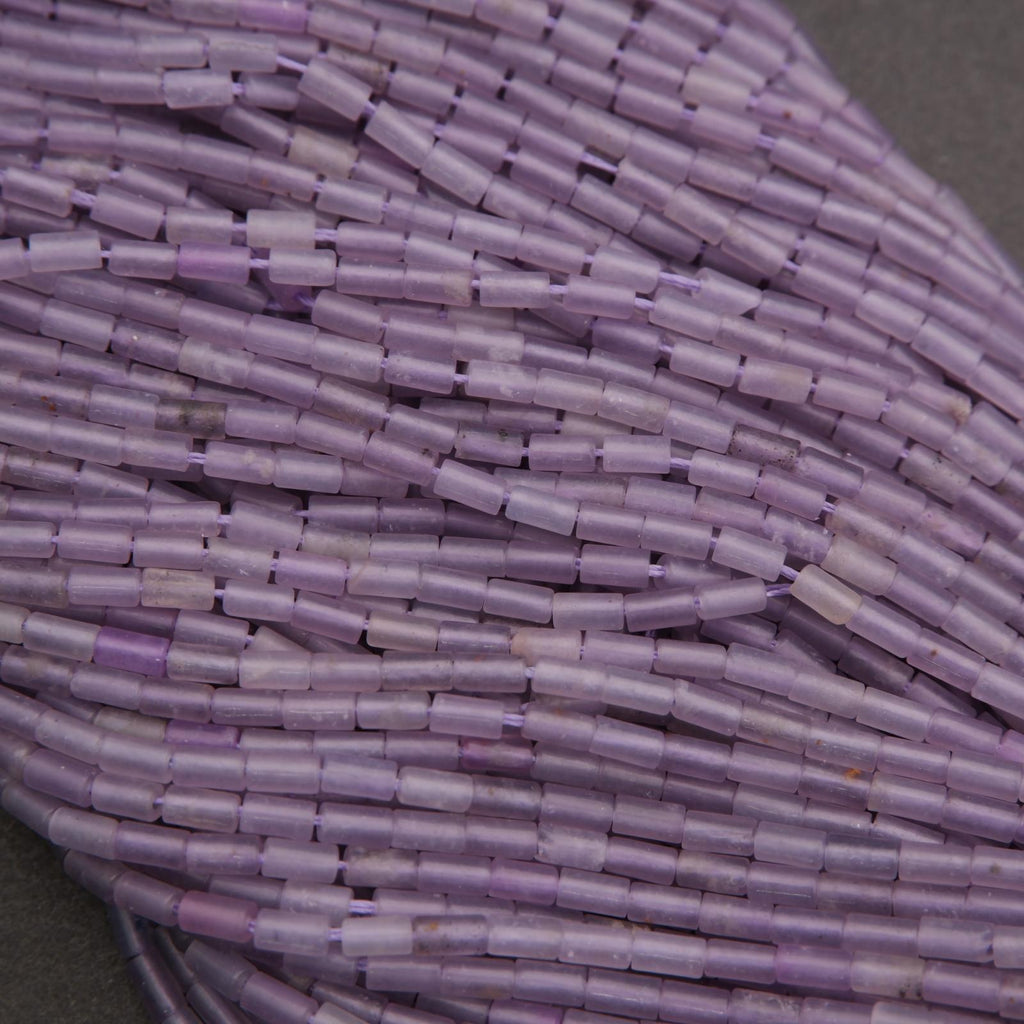 Close-up of a bundle of purple cylindrical beads.