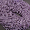 Close-up of purple yarn on a neutral background