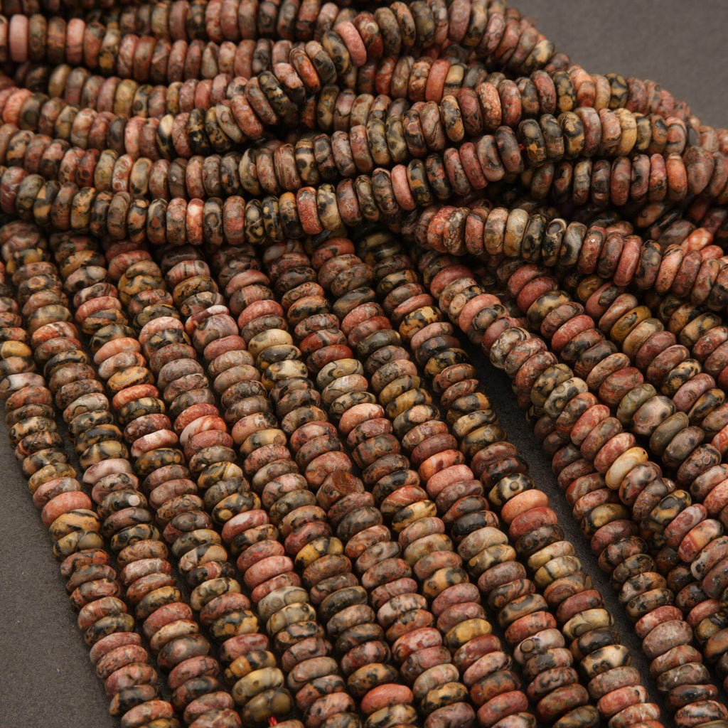 Close-up of multicolored stone beads on a dark background