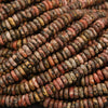 Close-up of a pile of multicolored stone beads.