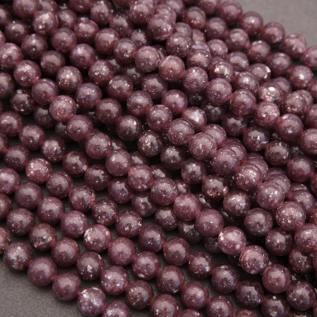 Close-up of purple beads on a gray background