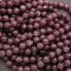 Close-up of purple beads on a dark background