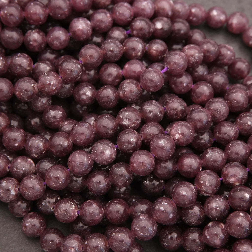 Close-up of purple beads on a dark background