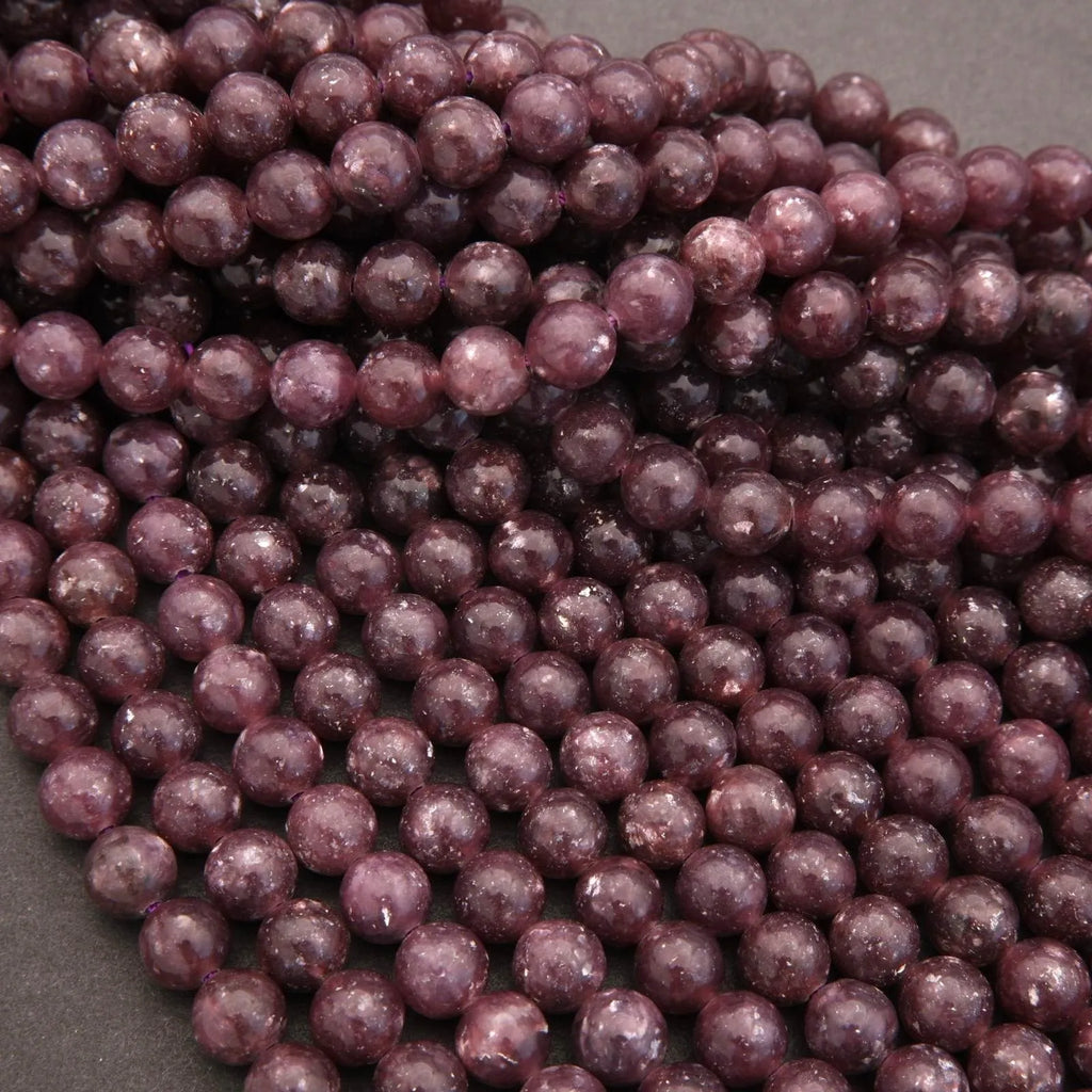 Close-up of purple beads on a gray background