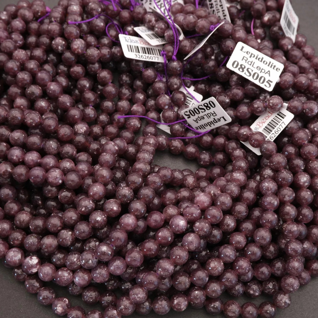 String of purple beads with labels on a gray background