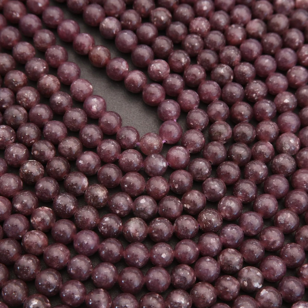 Close-up of purple beads on a dark background